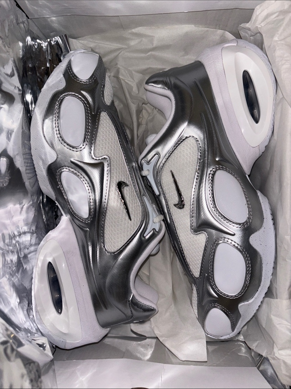 Nike Woman’s Metallic Silver and White Air-Cushioned Sneakers